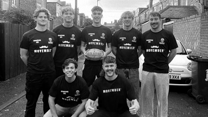 Newcastle University Rugby boys together in Movember t-shirts posing for picture