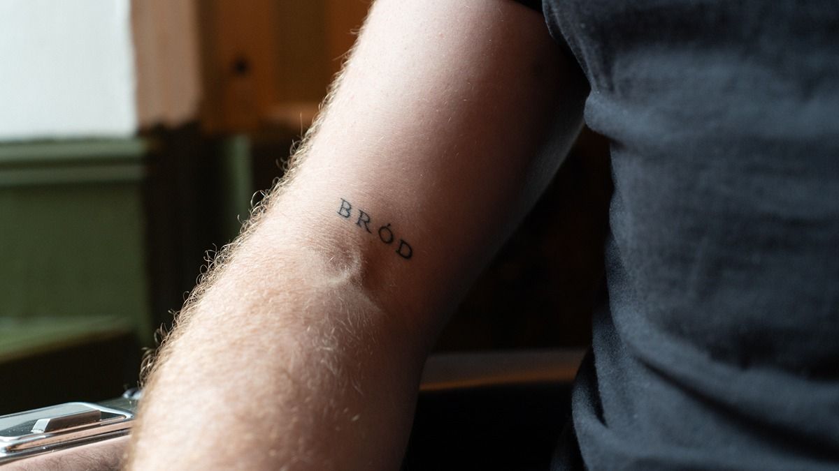 Cian's arm with a tattoo saying 'Brod' meaning pride