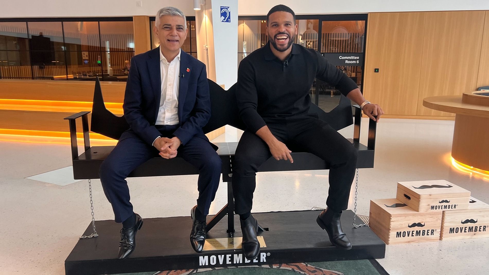 Kola Bokinni and Sadiq Khan sat on Movember's 'A Problem Halved' bench