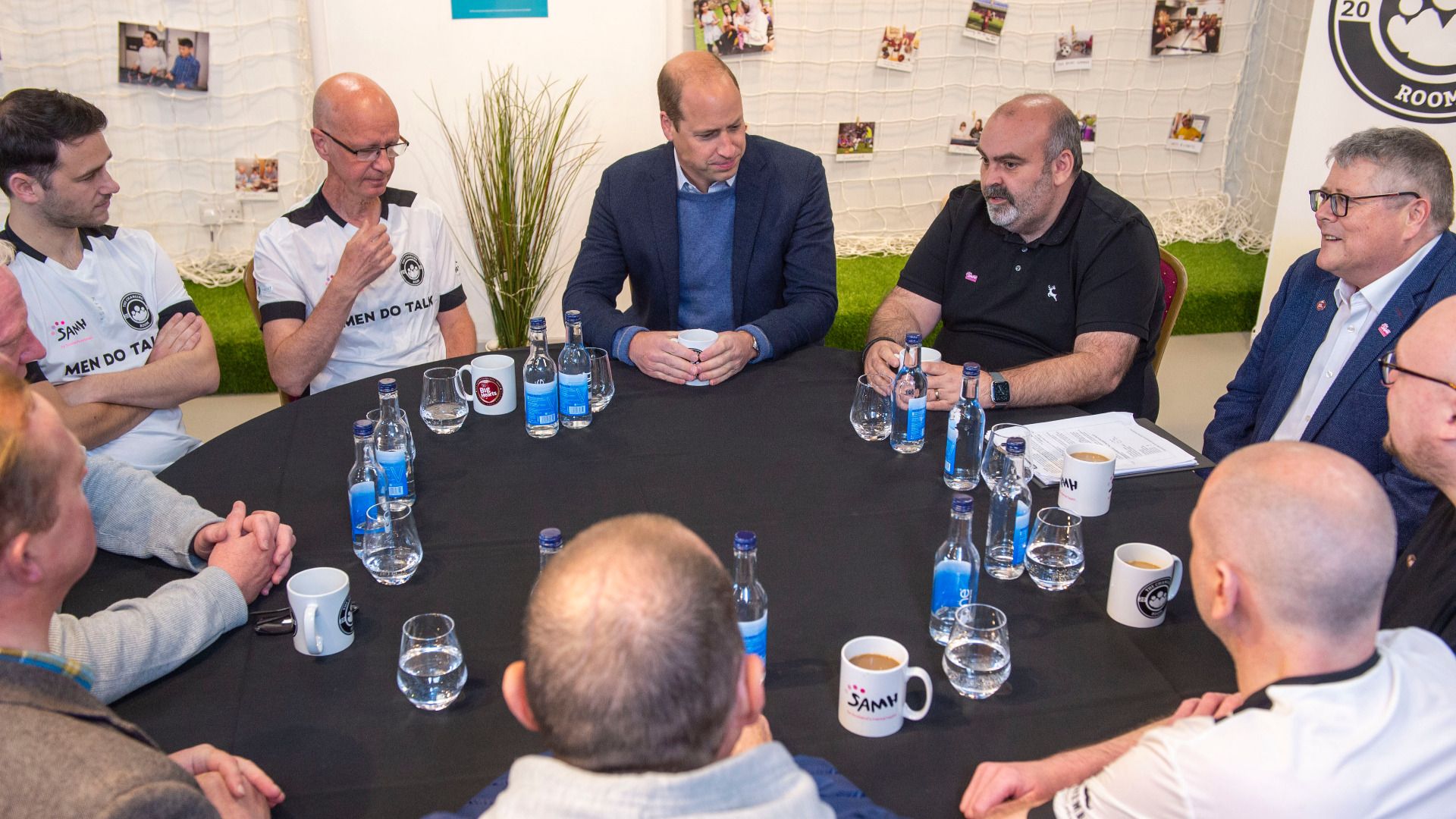 Duke of Cambridge sat round table with group of men