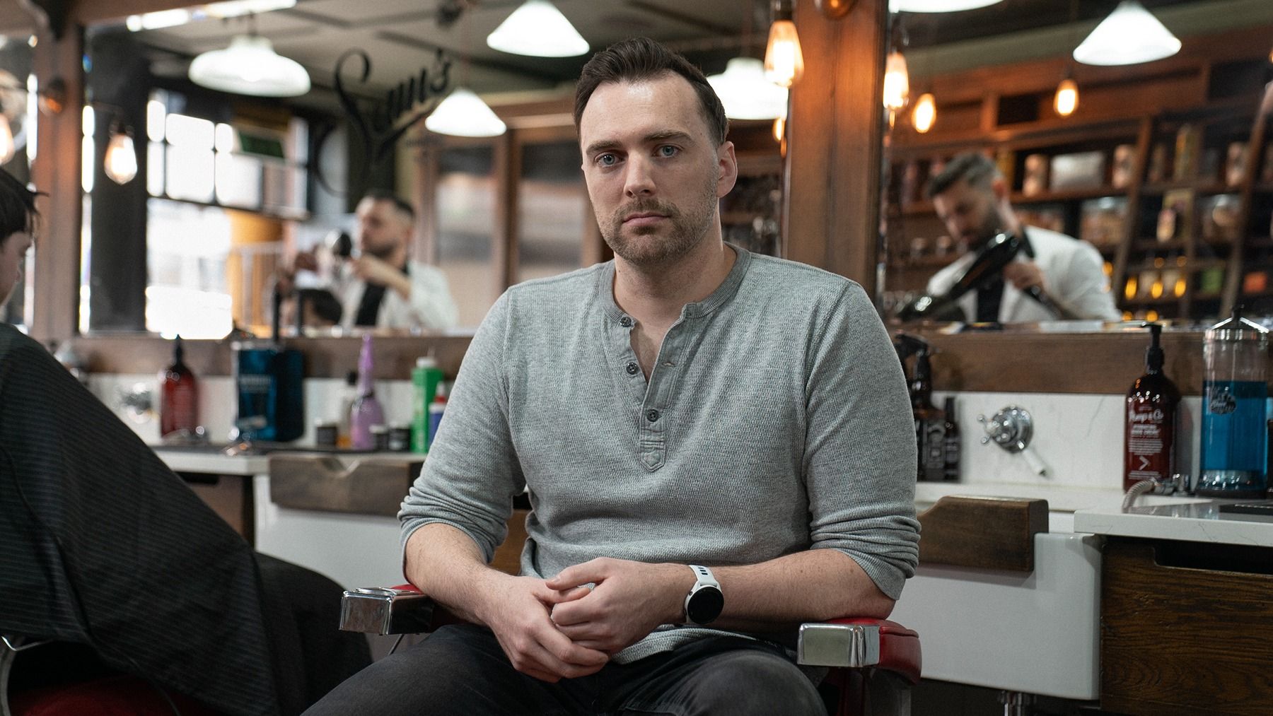Mo bro, Conor, sat in a barber chair