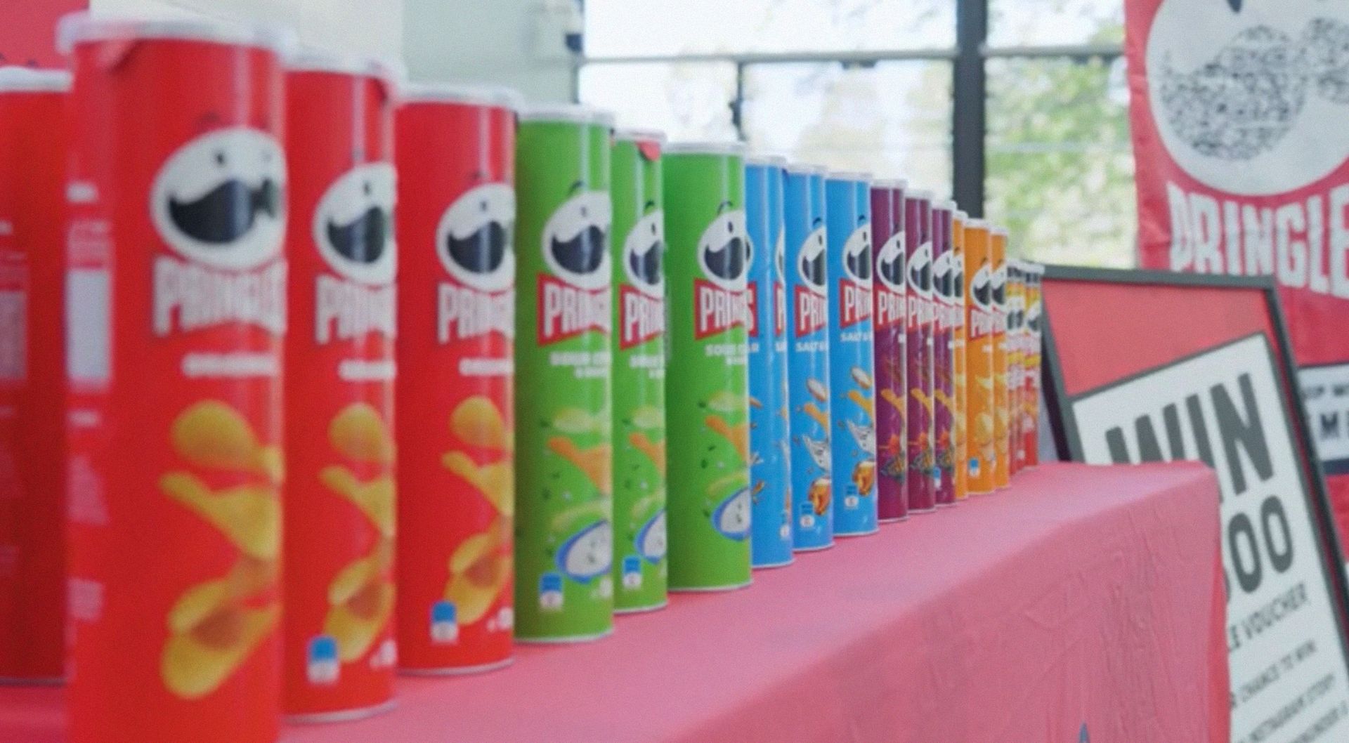 Photo of Pringles cans on a retail shelf.