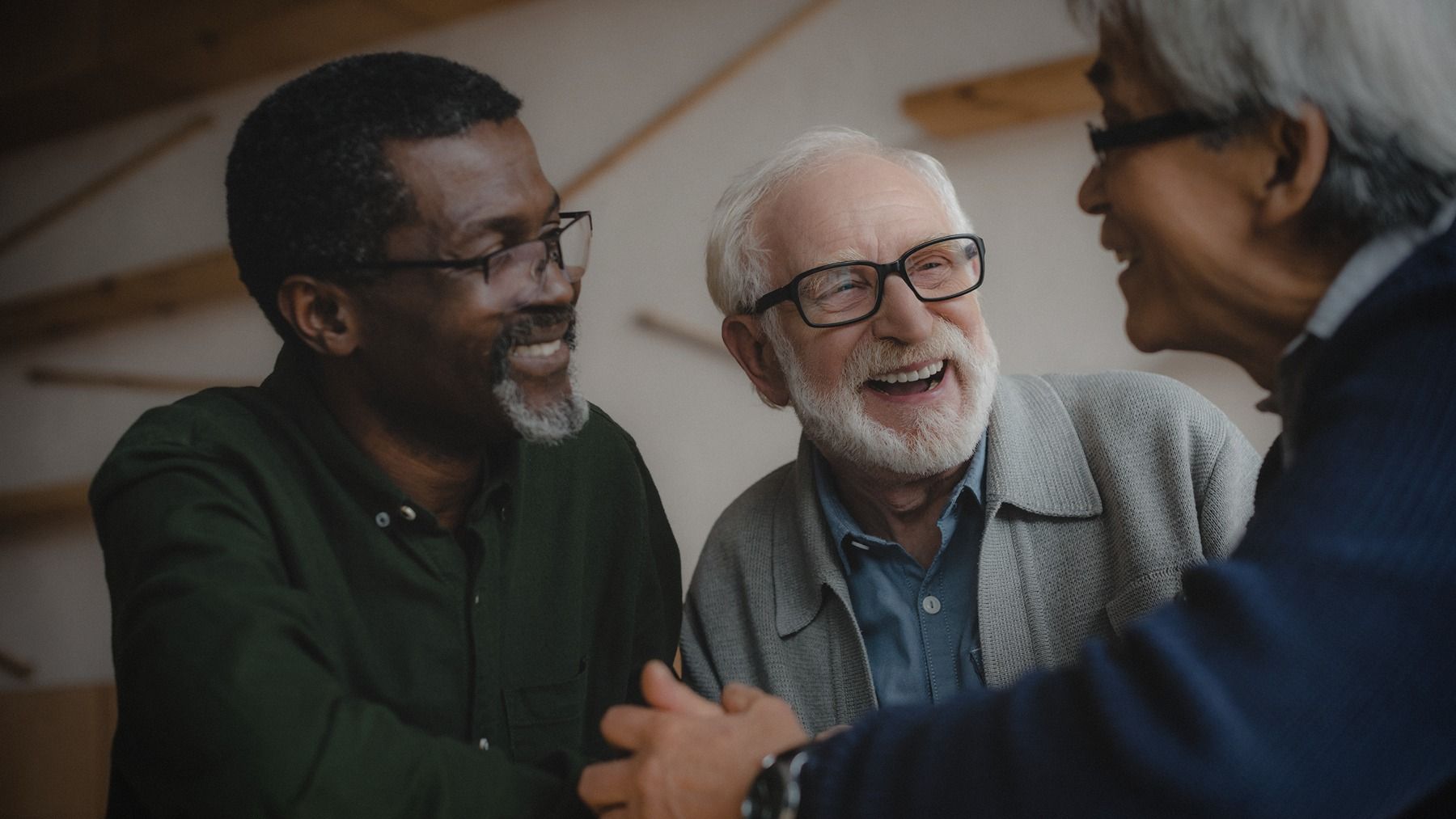 Three men smiling together