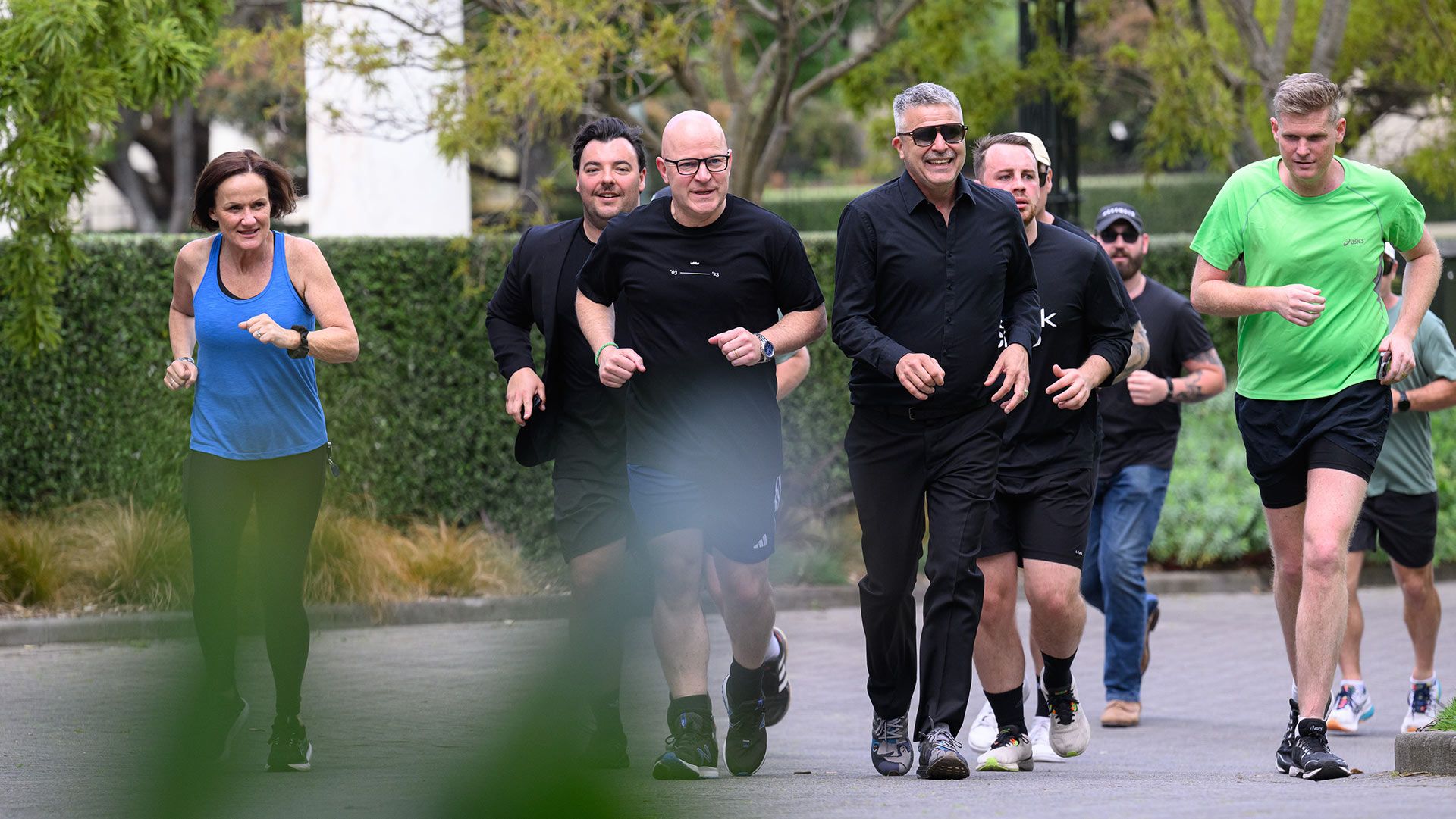 Photo of Movember personnel running with New Zealand Minister for Mental Health, the Hon Matt Doocey MP.