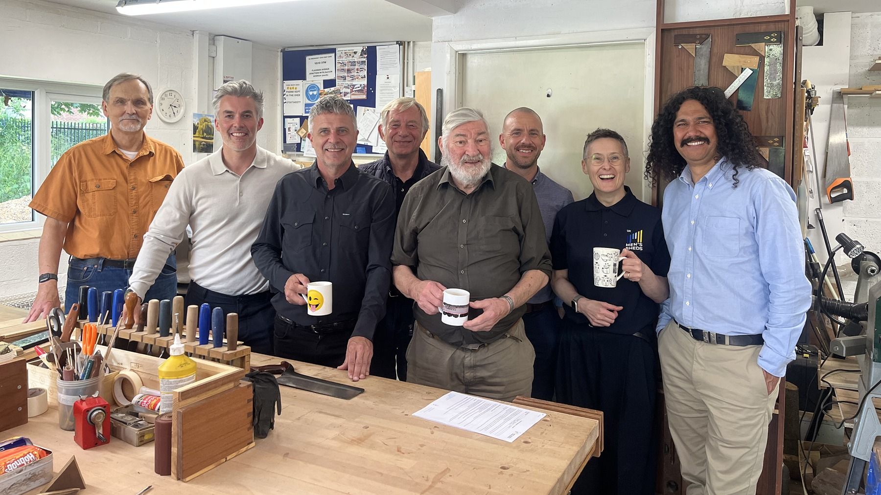 Group of guys and Movember founder at the Men's Shed