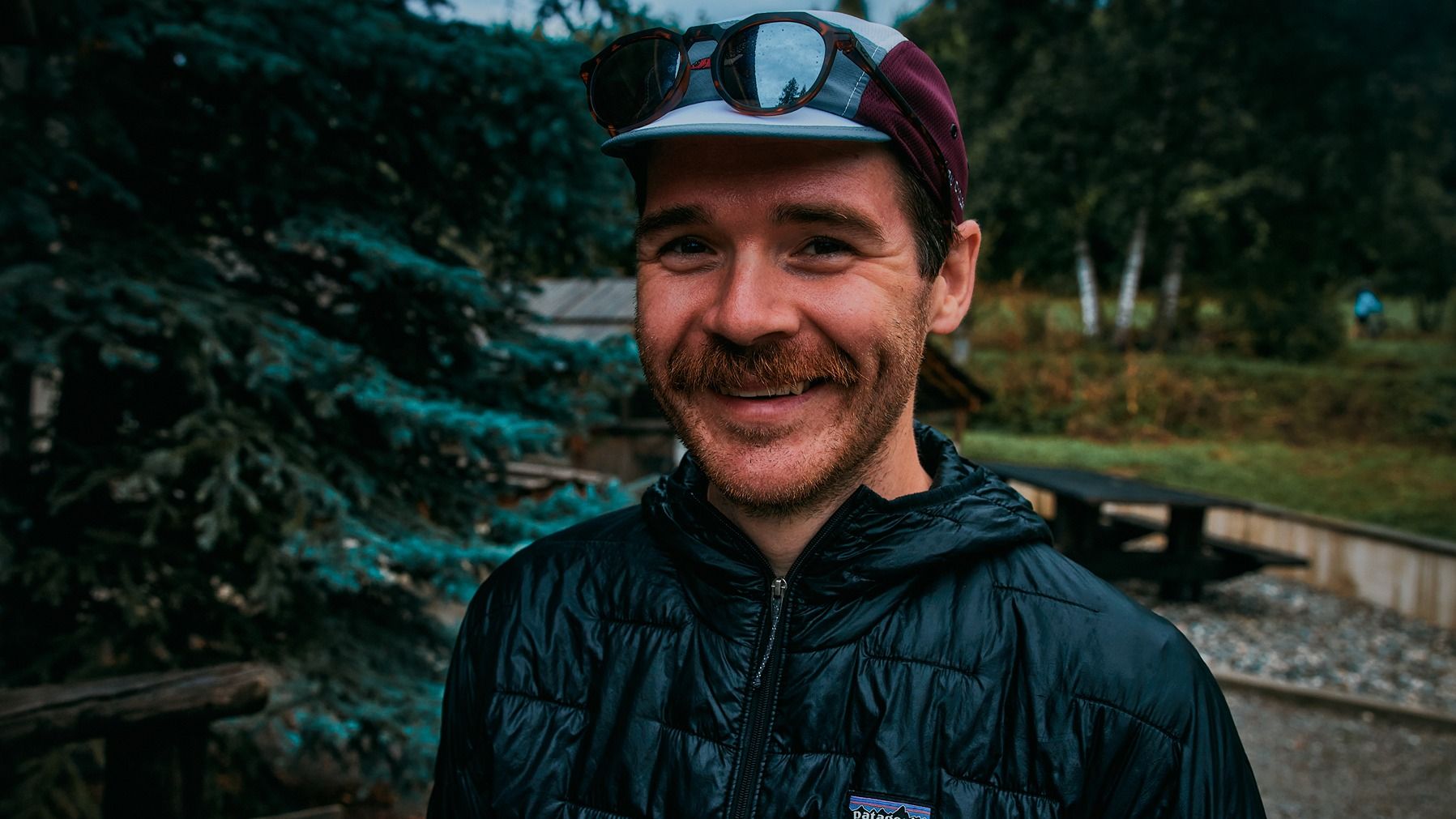Chris smiling to camera