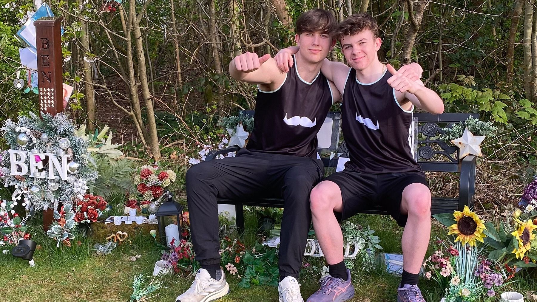 Brad and Calum sat by their friend's grave