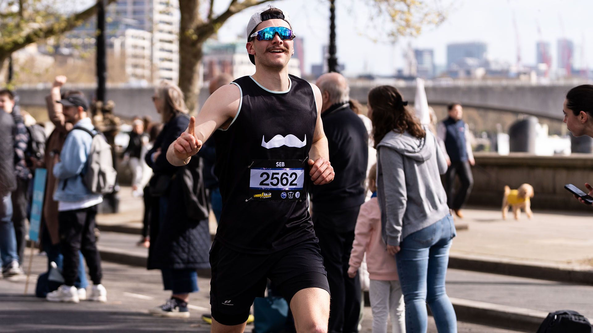 Photo of Paris Marathon participant, smiling to camera and wearing Movember-branded attire.