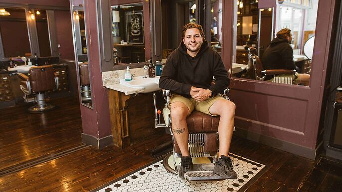 Man sitting in barber chair