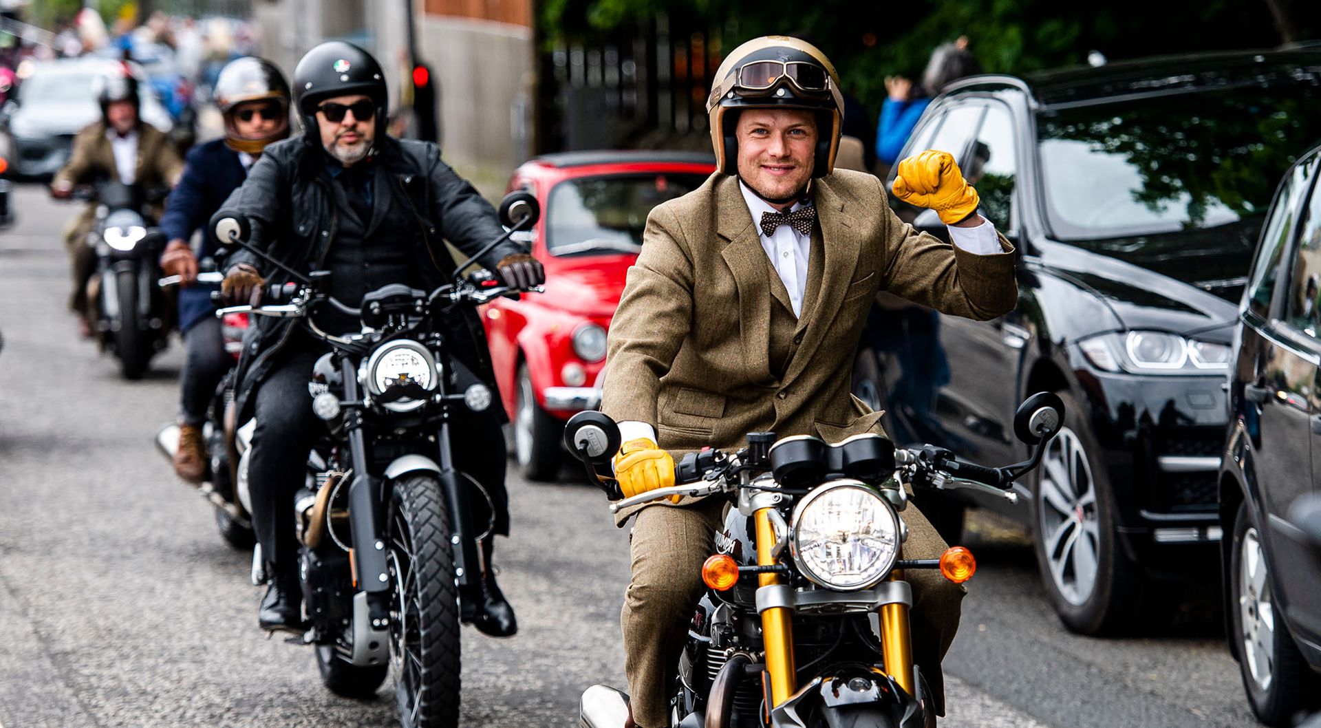 Finely dressed motorcycle riders riding for The Distinguished Gentleman's Ride.